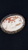 WHITE METAL & MOUNTED CAMEO DEPICTING A GREEK CHARIOTEER WITH GODDESSES & CHERUBS