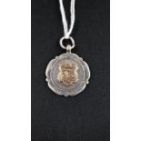 ANTIQUE SILVER SWIMMING MEDAL
