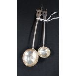 PAIR OF GRADUATED PERUVIAN SILVER TODDY LADLES