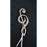 SILVER 'CLEF' BROOCH