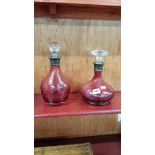 2 ANTIQUE RUBY GLASS DECANTERS WITH SILVER COLLARS