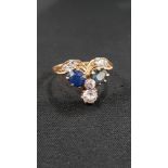 6 DIAMOND AND 2 SAPPHIRE GOLD RING