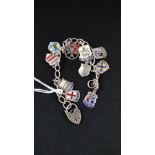 SILVER CHARM BRACELET WITH SILVER AND ENAMEL CHARMS