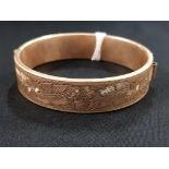 9 CARAT GOLD BANGLE WITH METAL CORE