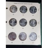 FOLDER OF AMERICAN EAGLE SILVER DOLLAR SERIES 1986 (WITH THE EXCEPTION OF 2003)