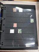 RHODESIA AND ZIMBABWE STAMPS IN BLACK ALBUM