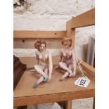 PAIR OF EROTICA PORCELAIN FEMALE FIGURES ON BLACK POLISHED BASES