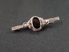 ANTIQUE SILVER AND BLACK STONE BROOCH
