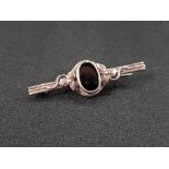 ANTIQUE SILVER AND BLACK STONE BROOCH