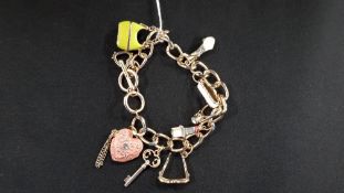 DESIGNER STYLE CHARM BRACELET WITH ADDED CHARMS TO INCLUDE LIPSTICK, SUNGLASSES ETC