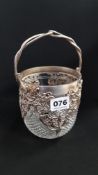 HEAVILY CUT CRYSTAL BISCUIT BARRELL WITH ORNATE HALLMARKED SILVER OPENWORK DECORATION