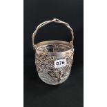 HEAVILY CUT CRYSTAL BISCUIT BARRELL WITH ORNATE HALLMARKED SILVER OPENWORK DECORATION