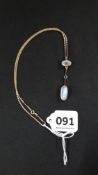 GOLD MOUNTED EDWARDIAN MOONSTONE AND SAPPHIRE DROP ON GOLD CHAIN