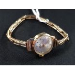 9 CARAT LADIES ROTARY WATCH ON 9 CARAT STRAP