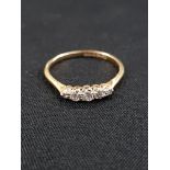 18 CARAT GOLD AND DIAMOND 5 STONE RING