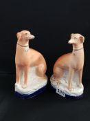 PAIR OF VICTORIAN SEATED STAFFORDSHIRE GREYHOUNDS