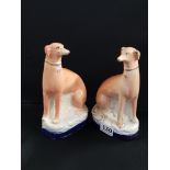 PAIR OF VICTORIAN SEATED STAFFORDSHIRE GREYHOUNDS