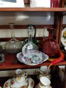SHELF LOT OF DECANTERS, GLASS FISH AND PLATE
