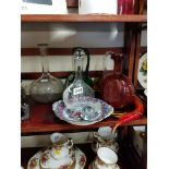 SHELF LOT OF DECANTERS, GLASS FISH AND PLATE