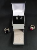 2 PAIRS OF SILVER EARRINGS AND A SILVER RING