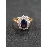 18 CARAT GOLD SAPPHIRE AND DIAMOND CLUSTER RING