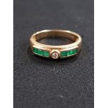 CHANNEL SET EMERALD AND DIAMOND RING