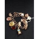 9 CARAT GOLD CHARM BRACELET POSSIBLY SOME HIGH CARAT CHARMS 60.55G