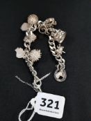 WELL DECORATED SILVER CHARM BRACELET