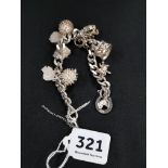 WELL DECORATED SILVER CHARM BRACELET