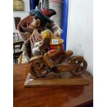 CARVED WOODEN PINOCCHIO AND BICYCLE