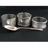 3 SILVER NAPKIN RINGS AND SILVER SPOON