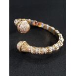 18 CARAT YELLOW GOLD TWIST BANGLE SET WITH 18 CARAT WHITE GOLD BANDS, DIAMOND ENCRUSTED FINIALS WITH