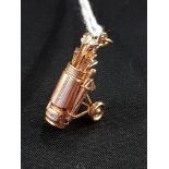 9 CARAT GOLD CLUB AND BUGGY CHARM/PENDANT 6.8 GMS