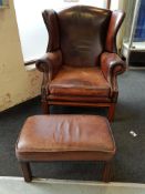 WING BACK LEATHER ARMCHAIR AND MATCHING FOOTSTOOL