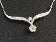 14 CARAT WHITE GOLD AND DIAMOND NECKLACE SET IN AN ANTIQUE STYLE WITH PAVE DET AND CLAW SETTING ON