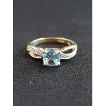 9 CARAT GOLD DIAMOND AND BLUE TOPAZ RING