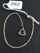 9CT GOLD MOUNTED MYSTIC TOPAZ AND DIAMOND PENDANT ON 9CT GOLD CHAIN