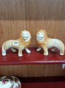 PAIR OF SMALL STAFFORDSHIRE LIONS