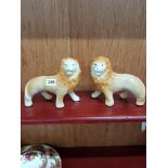 PAIR OF SMALL STAFFORDSHIRE LIONS