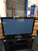 LARGE FLAT SCREEN TV AND STAND