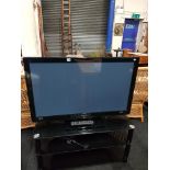 LARGE FLAT SCREEN TV AND STAND