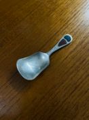 A GEORGE V SILVER CADDY SPOON BY JOSEPH COOK & SON - THE SHOVEL SHAPED BOWL INSCRIBED 'INVERNESS' TO