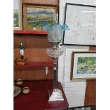 OIL LAMP WITH SILVER PLATED CORINTHIAN COLUMN, HEAVILY CUT BOWL AND BLUE SHADE