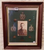 Framed military photo and badges