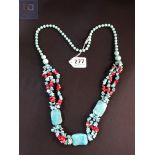 PAIR OF LONG TURQUOISE AND CORAL BEADS