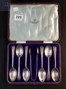 CASED SILVER TEASPOON SET AND SUGAR TONGS SHEFFIELD BY WALKER AND HALL