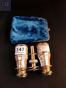 Pair of opera glasses in case