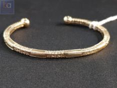 9 CARAT GOLD TORQUE BANGLE 28 GRAMS