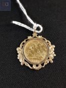 22 carat gold half sovereign in 9 carat gold mount Edward V 1902