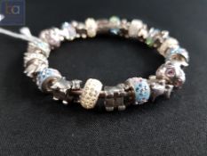 SILVER 'TRUTH' BRACELET WITH SILVER AND CRYSTAL CHARMS
